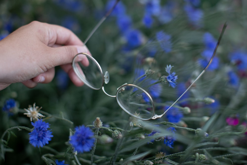 a person cuts a pair of scissors