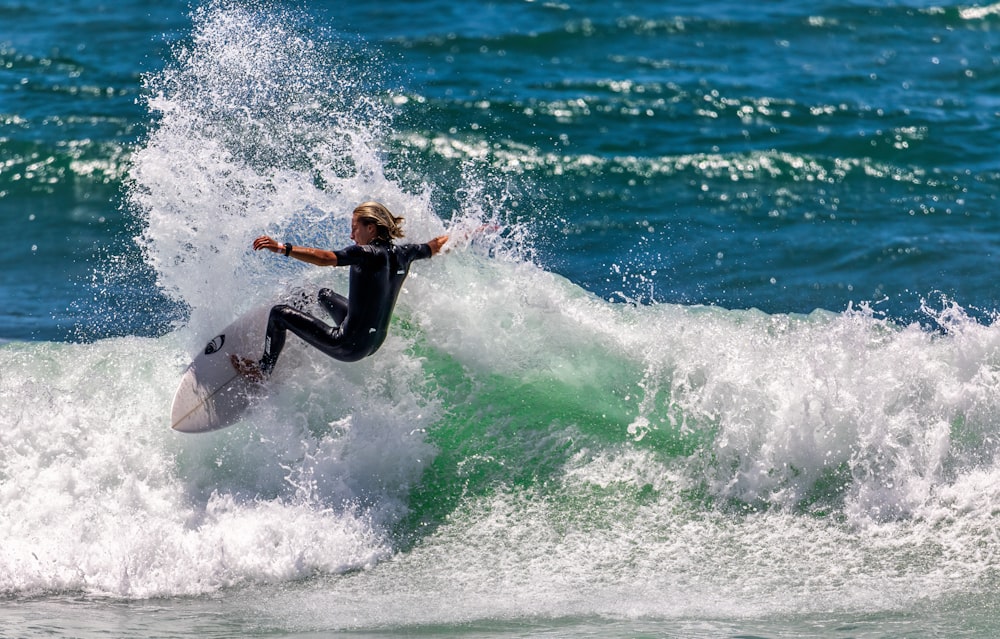 a person surfing on the waves