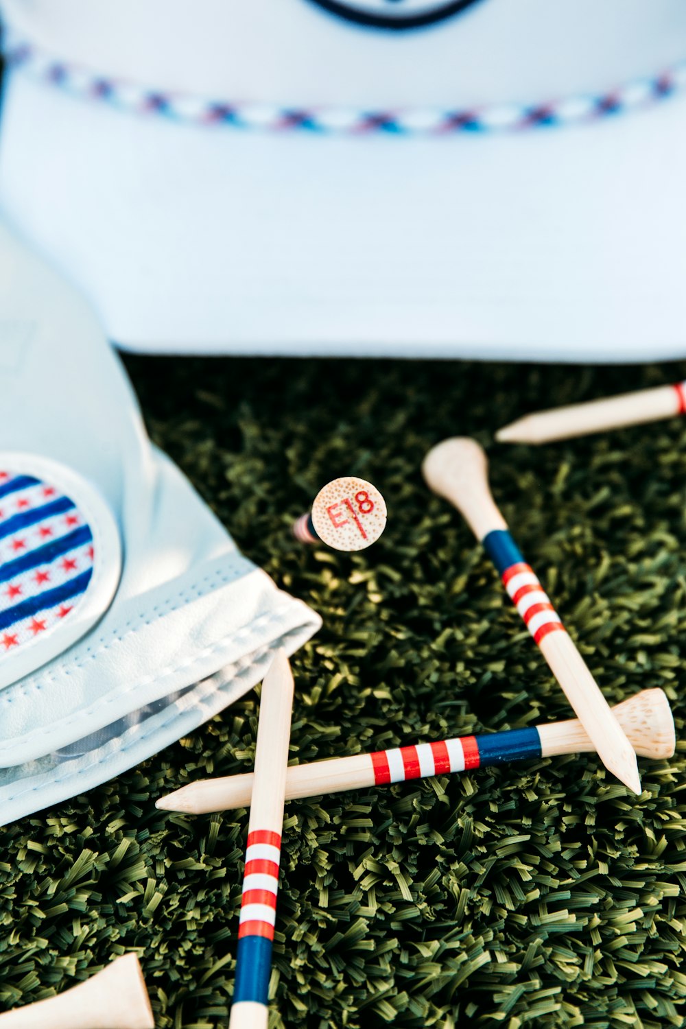 a group of sticks with a flag in the background