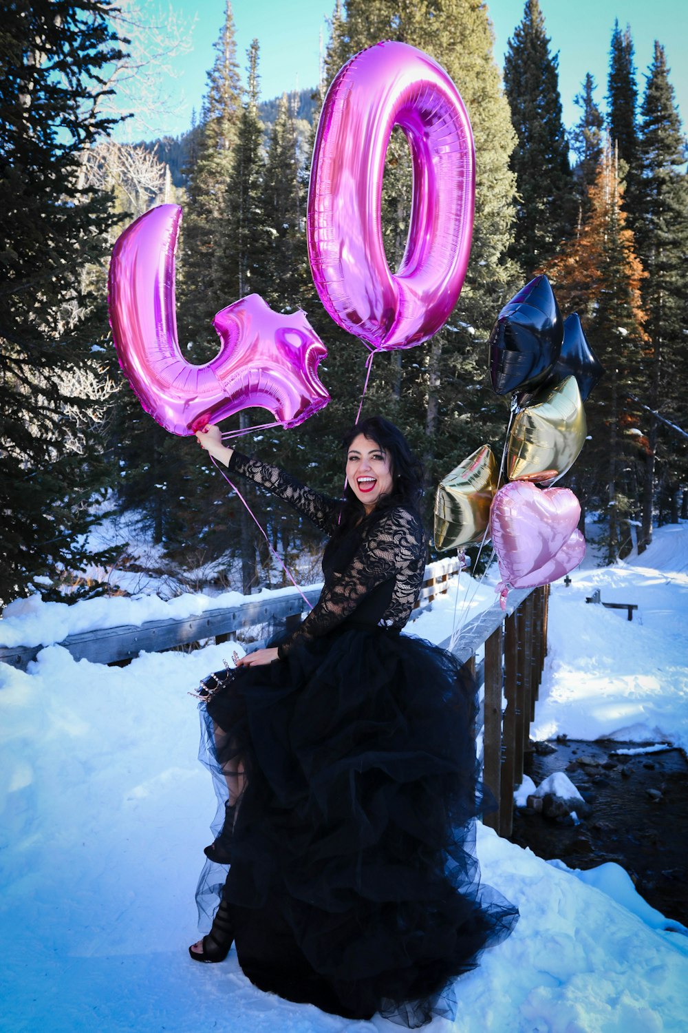 a person holding a pink balloon