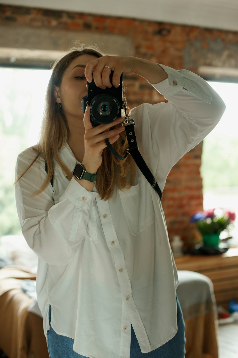 a woman holding a camera