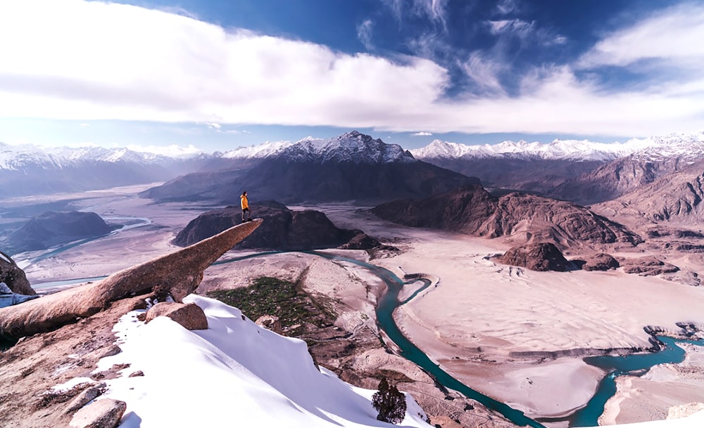 a person standing on a mountain