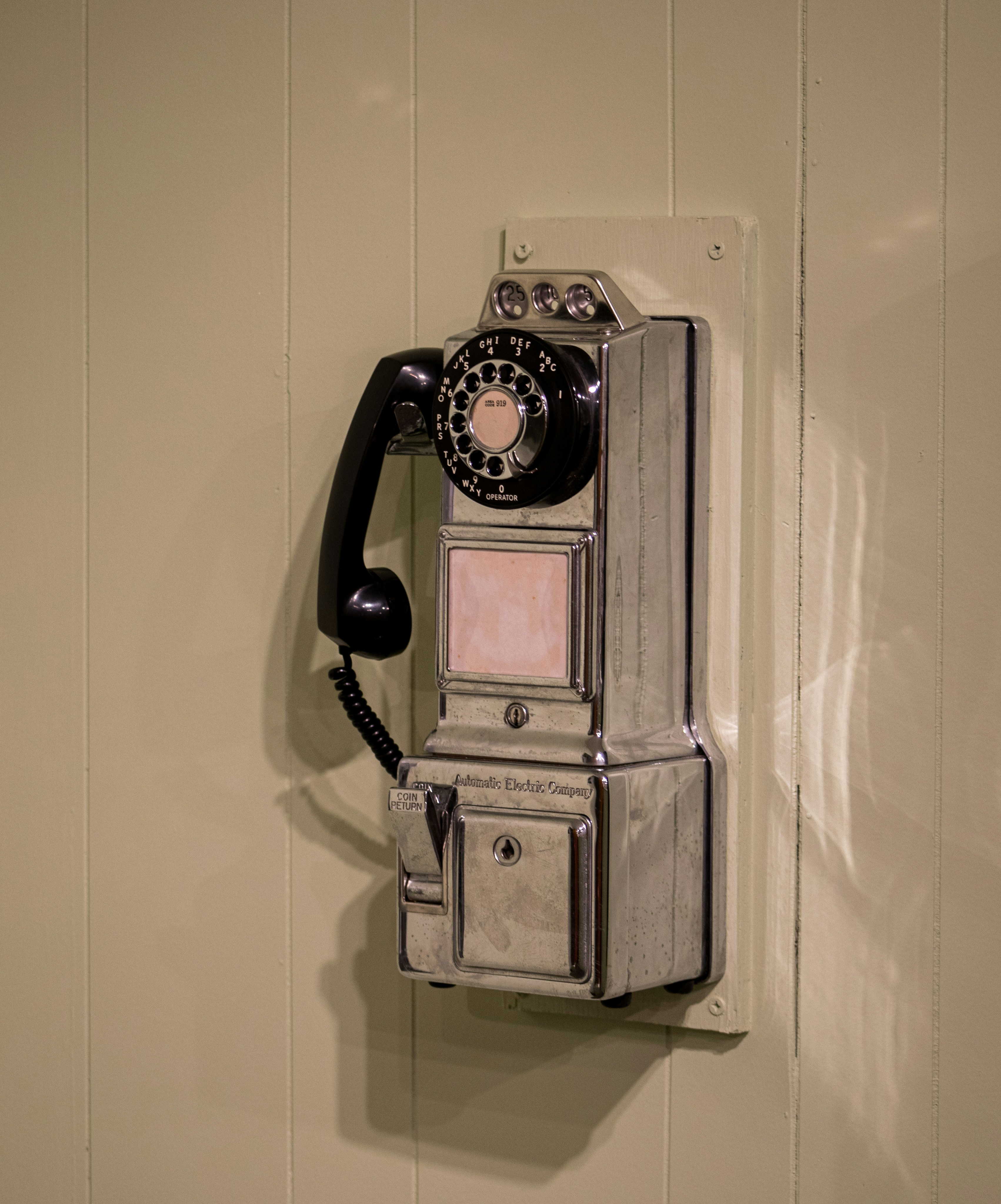 Antique payphone located at the telephone museum in Maitland FL.