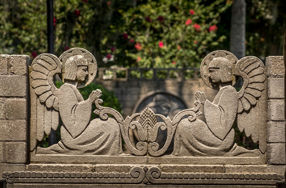 a statue of a person sitting on a bench