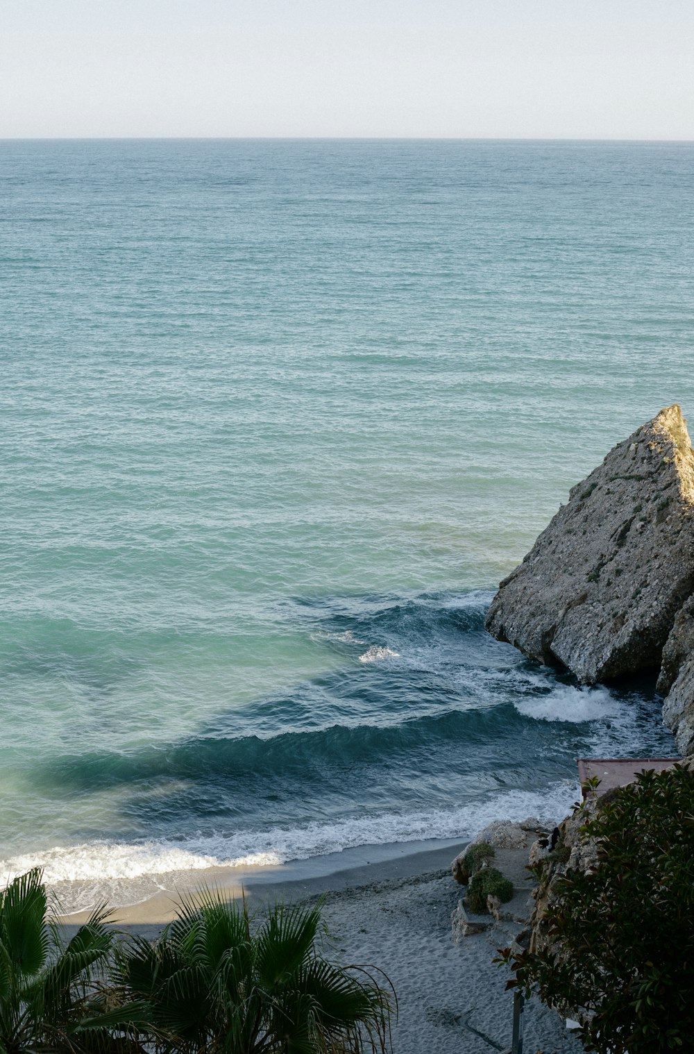 a rocky beach with waves crashing