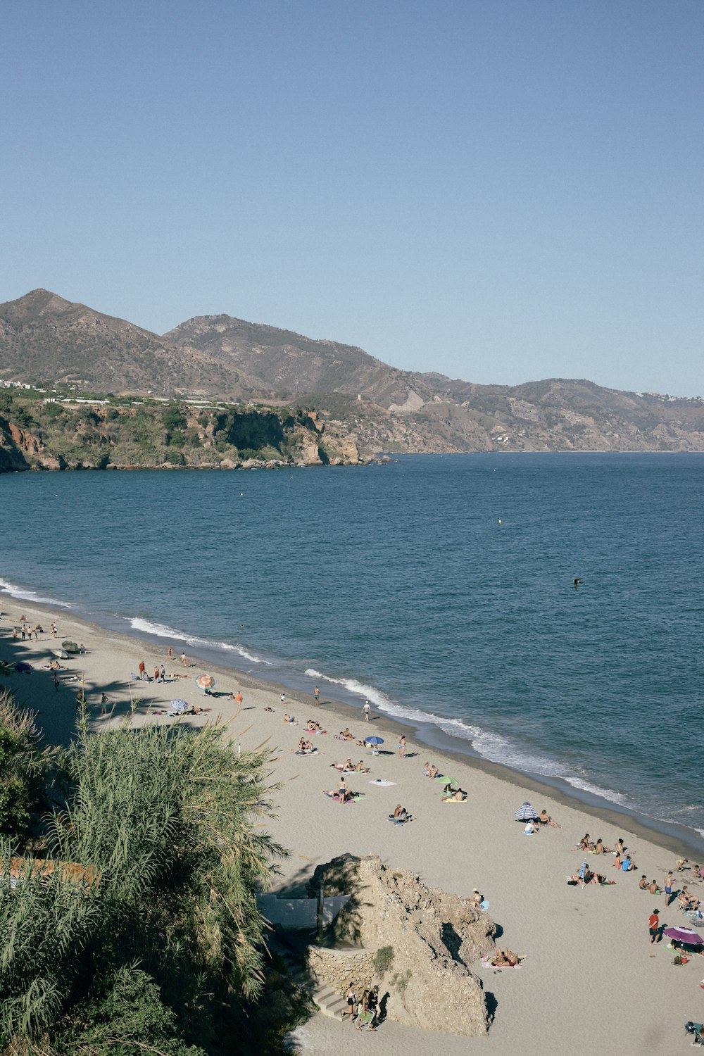 a beach with people on it