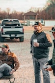 a group of men sitting on the ground