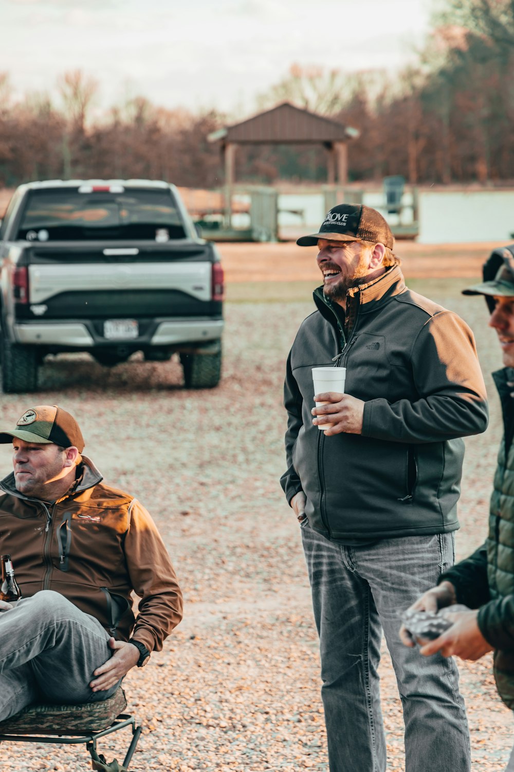 a group of men sitting on the ground