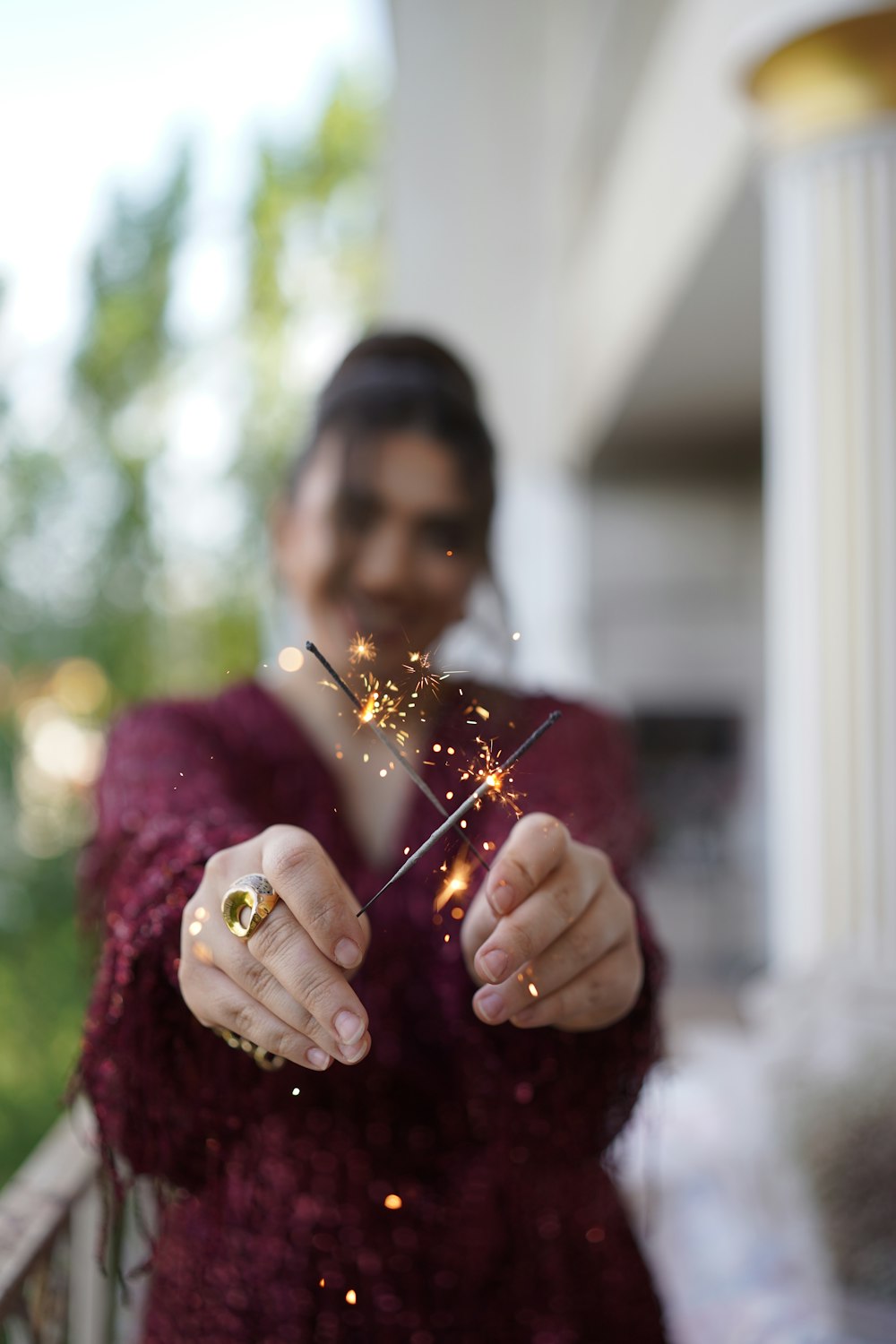 a woman holding a lit candle