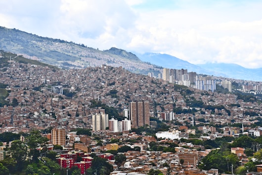 a city with mountains in the background