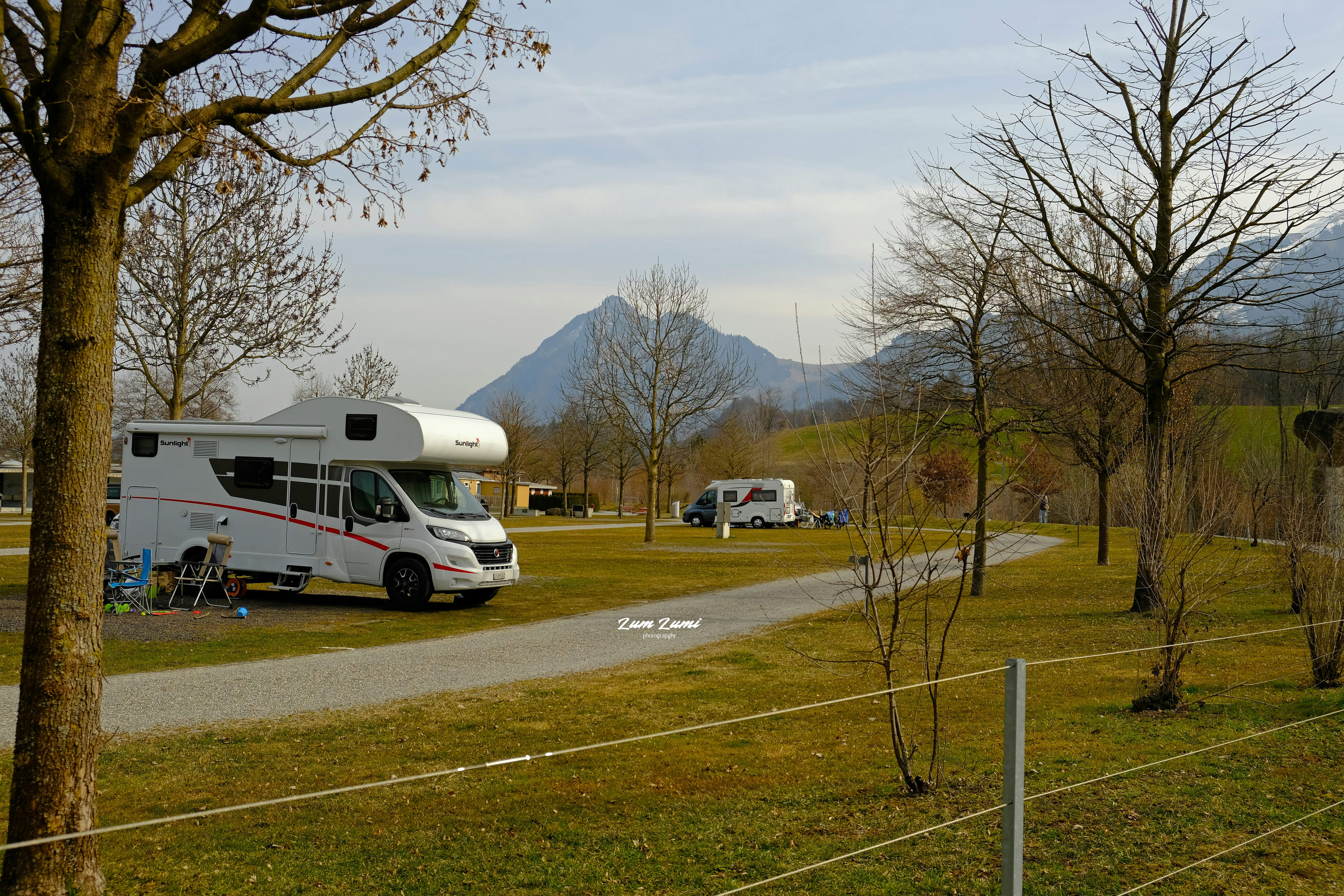 a couple of rvs parked in a parking lot