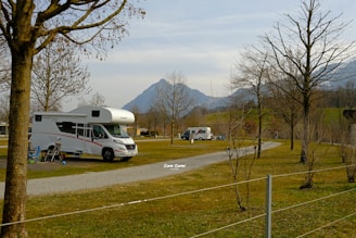 a couple of rvs parked in a parking lot