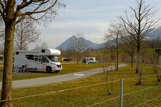 a couple of rvs parked in a parking lot