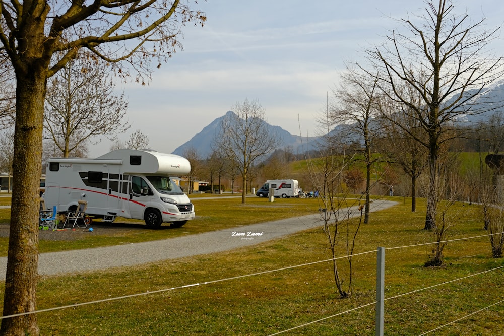 a couple of rvs parked in a parking lot