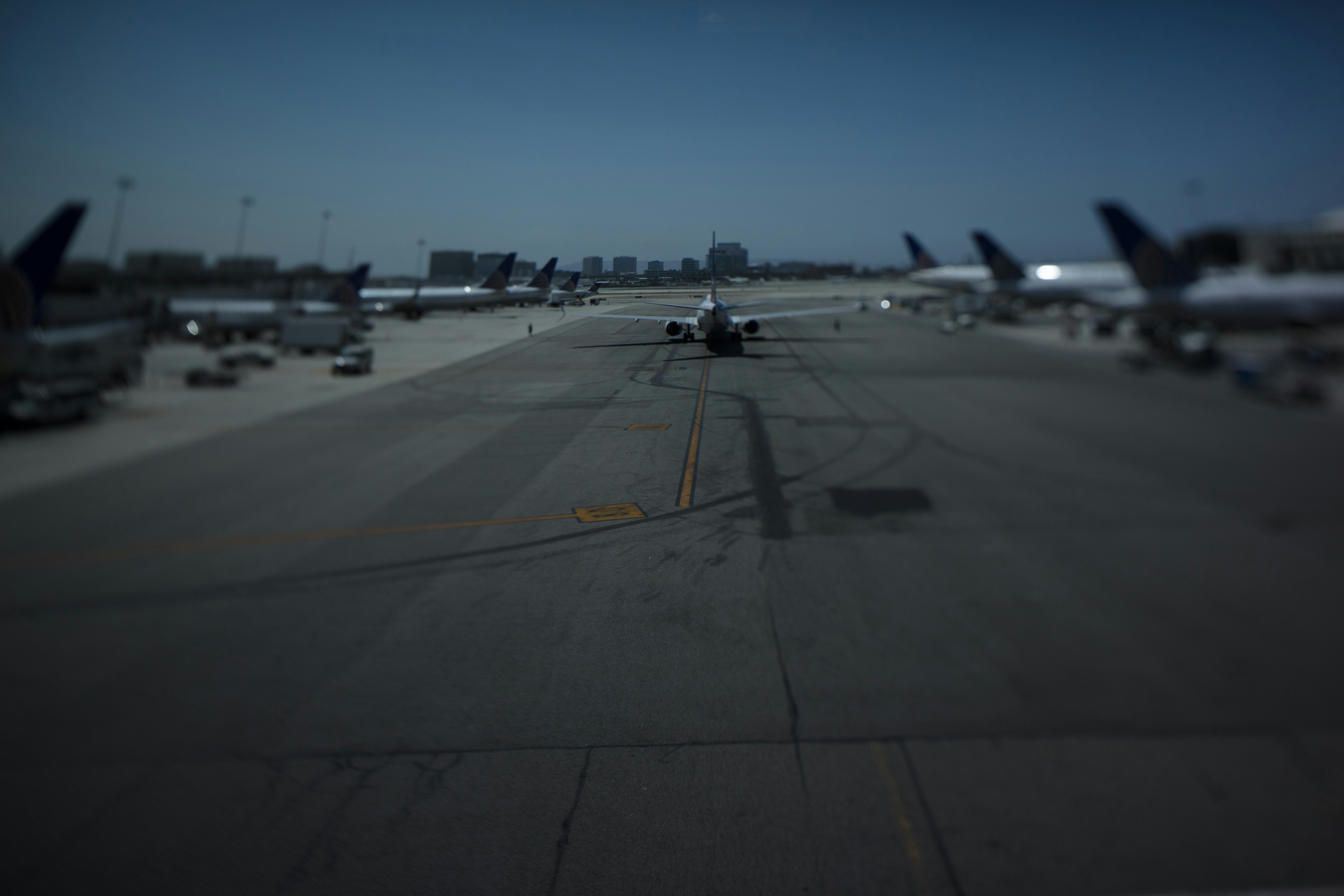 a group of airplanes on a runway, 