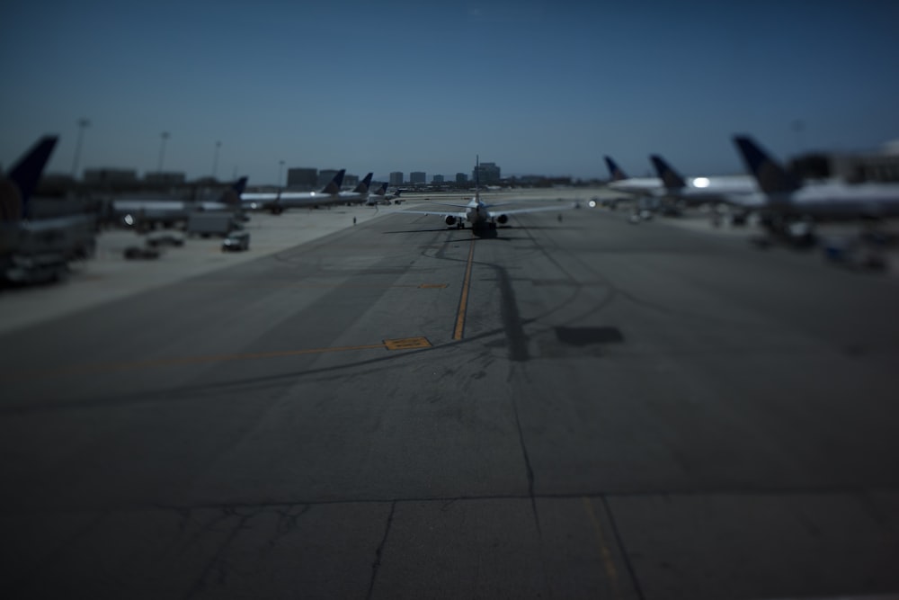 a group of airplanes on a runway