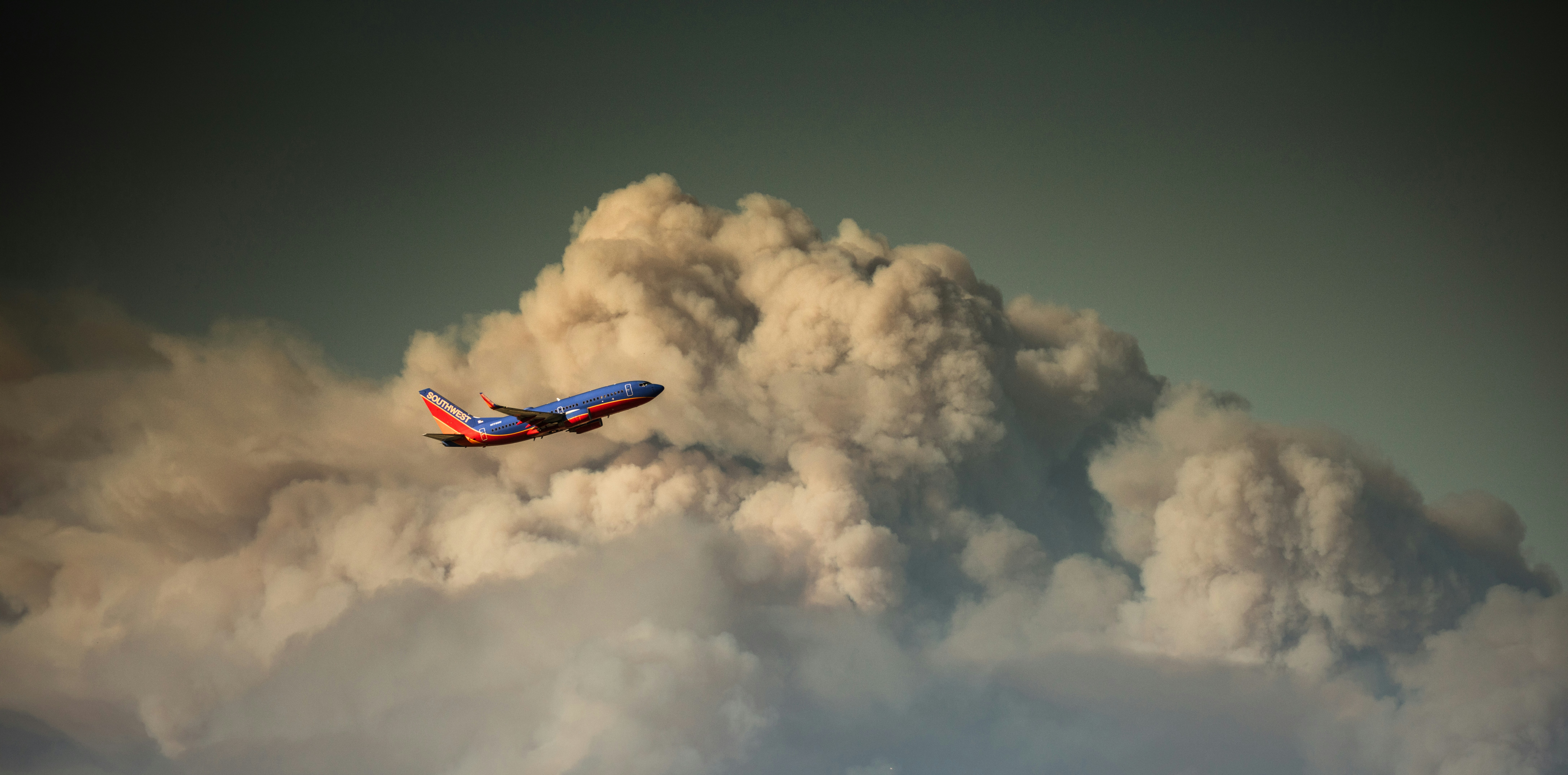 a plane flying through the clouds