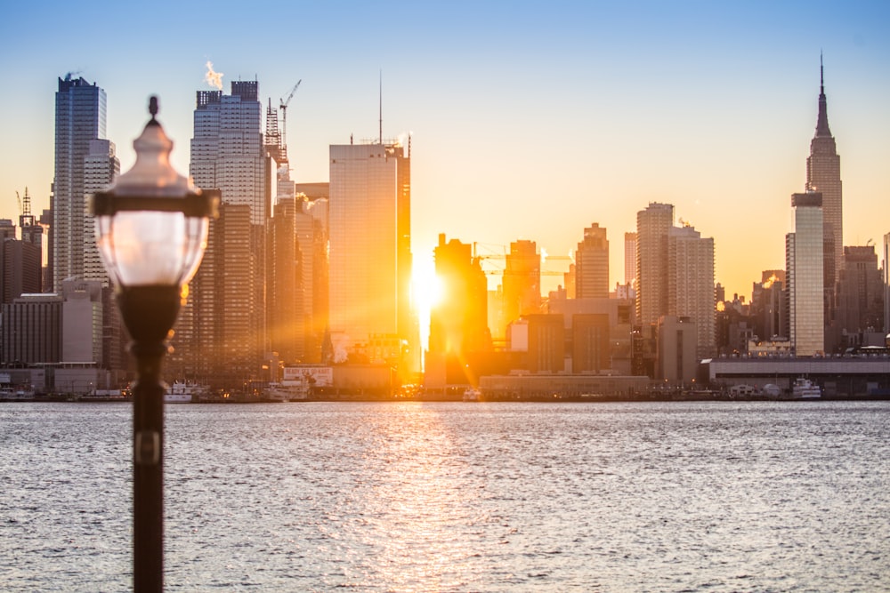 a city skyline with a lamp post