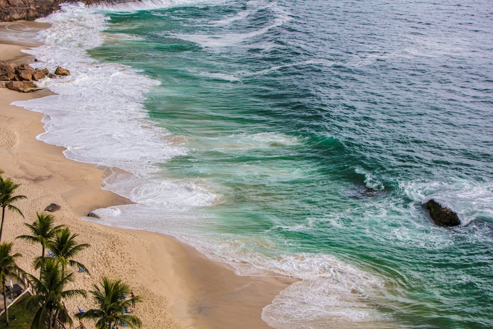 a beach with waves crashing on it