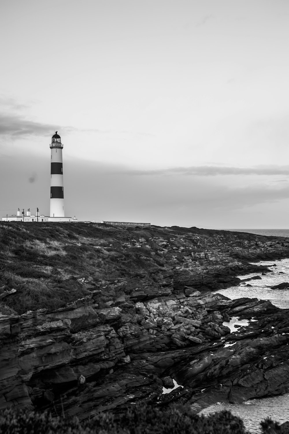 a lighthouse on a rocky shore