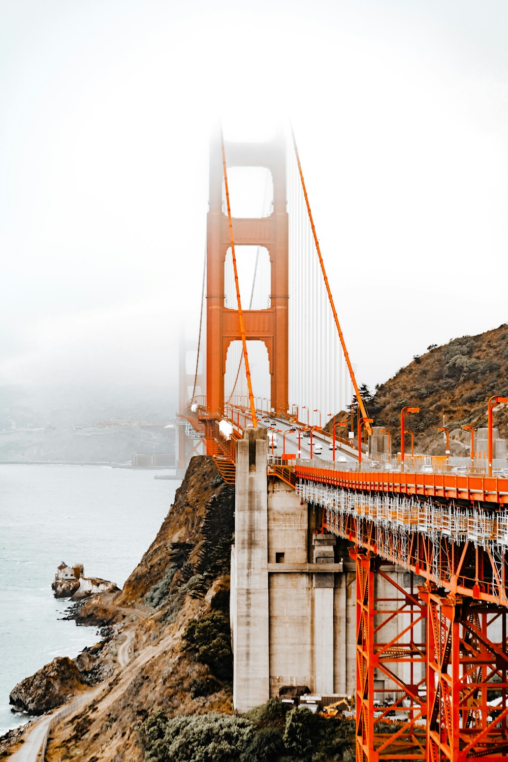 a bridge with a large orange bridge