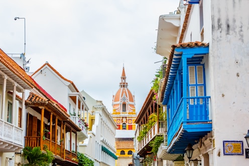 a row of buildings with a steeple