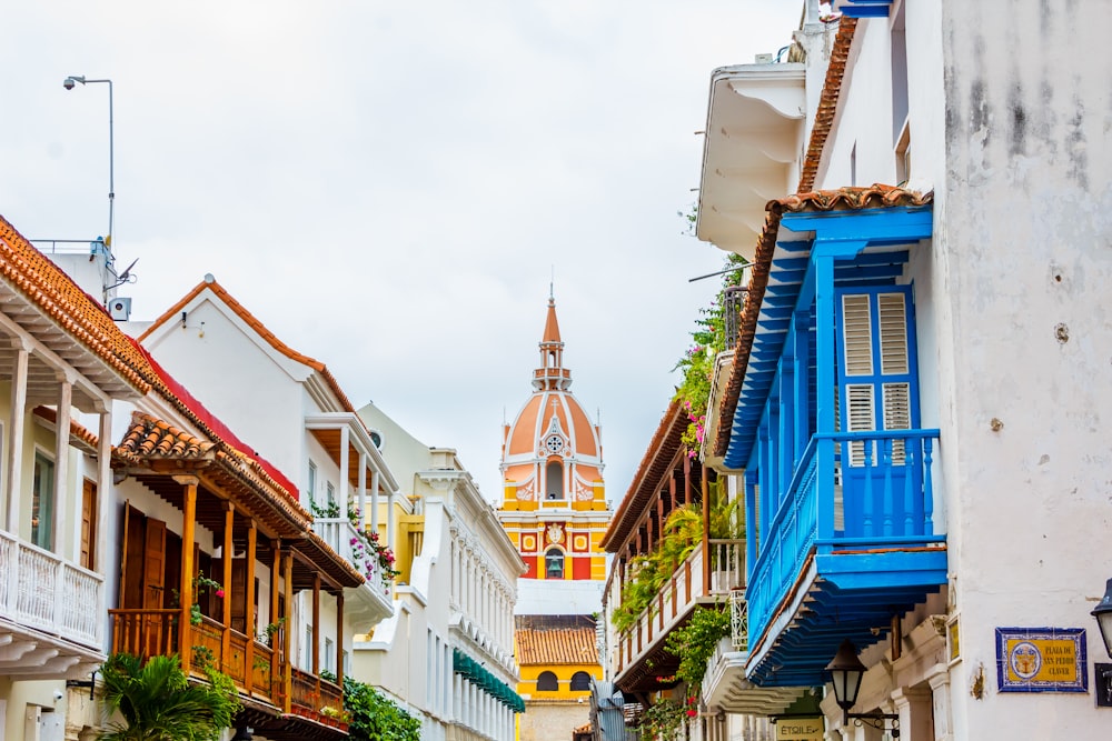 a row of buildings with a steeple