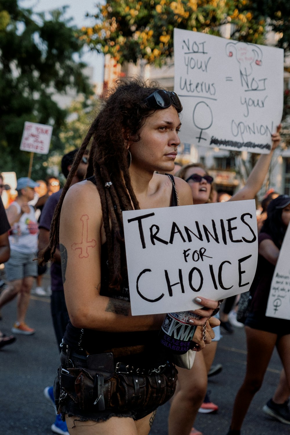 a woman holding a sign