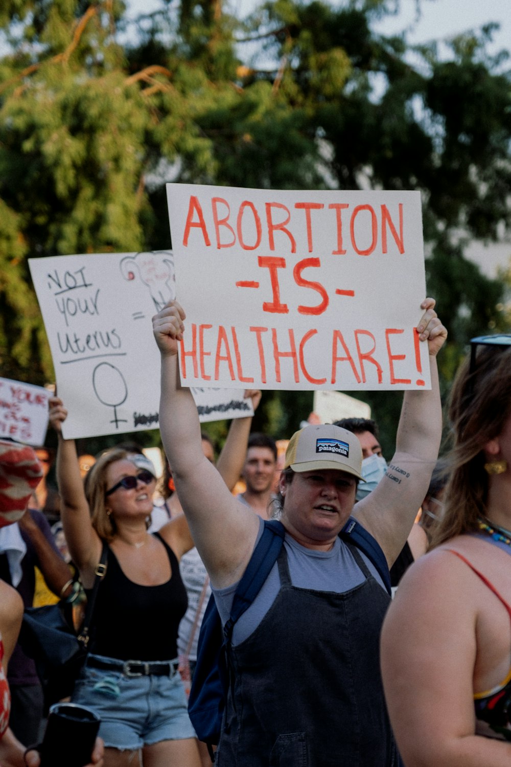 a group of people holding signs