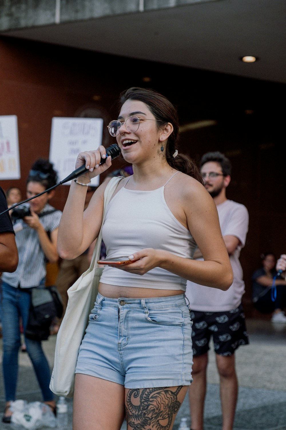 a person singing into a microphone