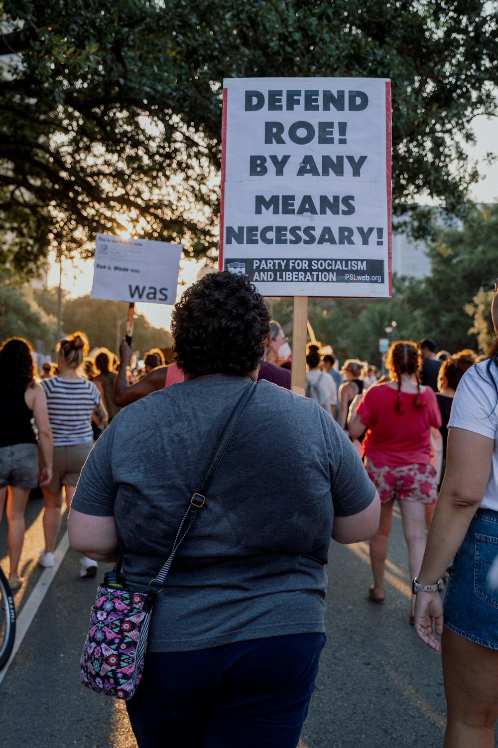 a person holding a sign