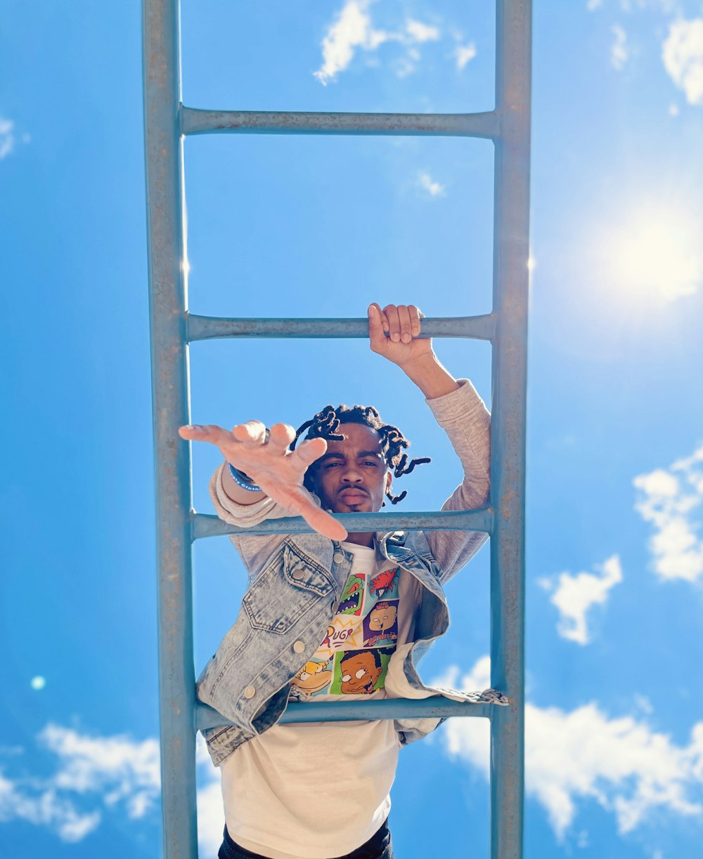 a person holding onto a pole