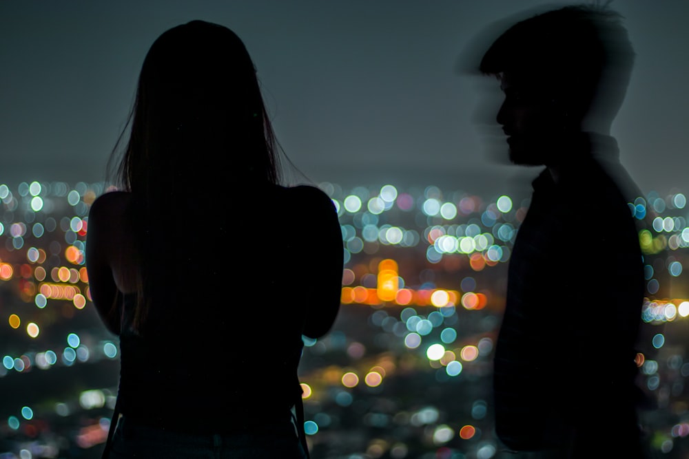 a man and woman looking at each other