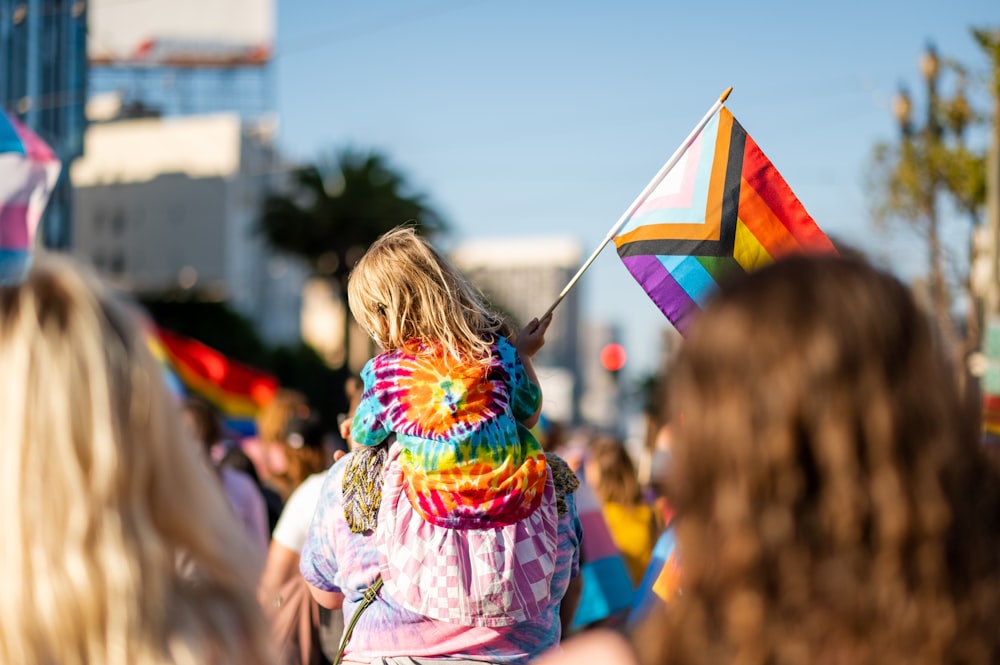 a group of people holding a kite