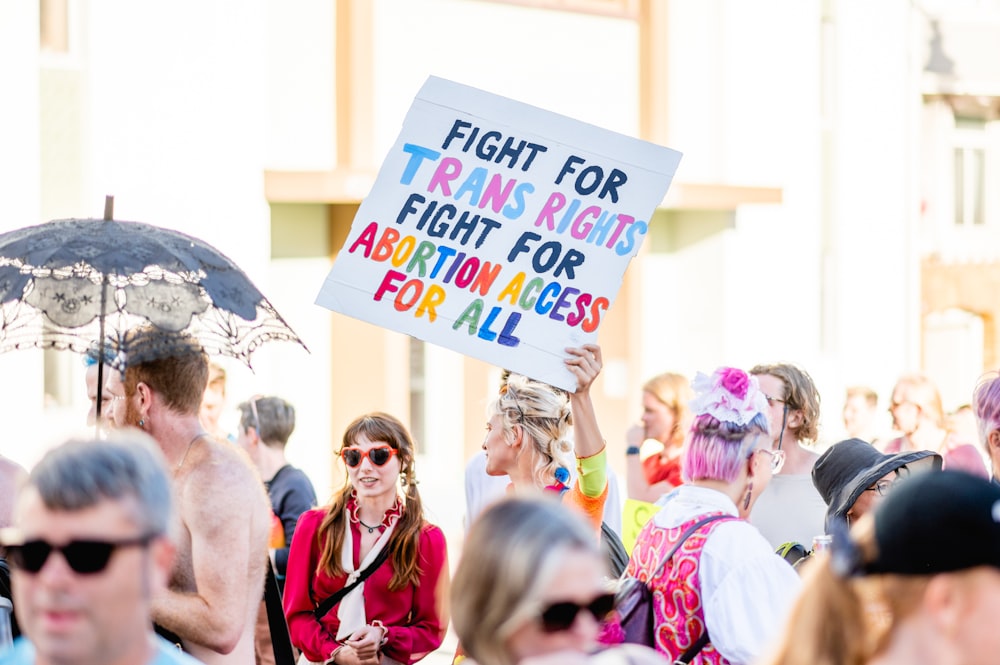 a group of people holding signs