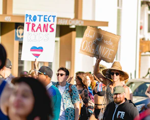 a group of people holding signs