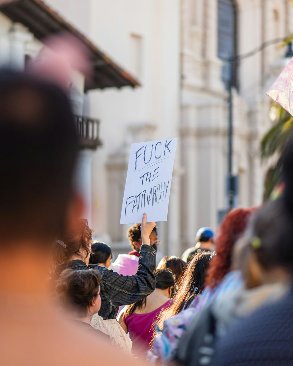 a group of people holding a sign