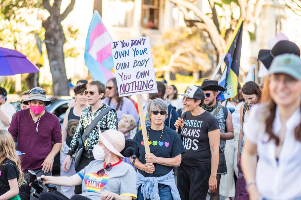 a group of people holding signs