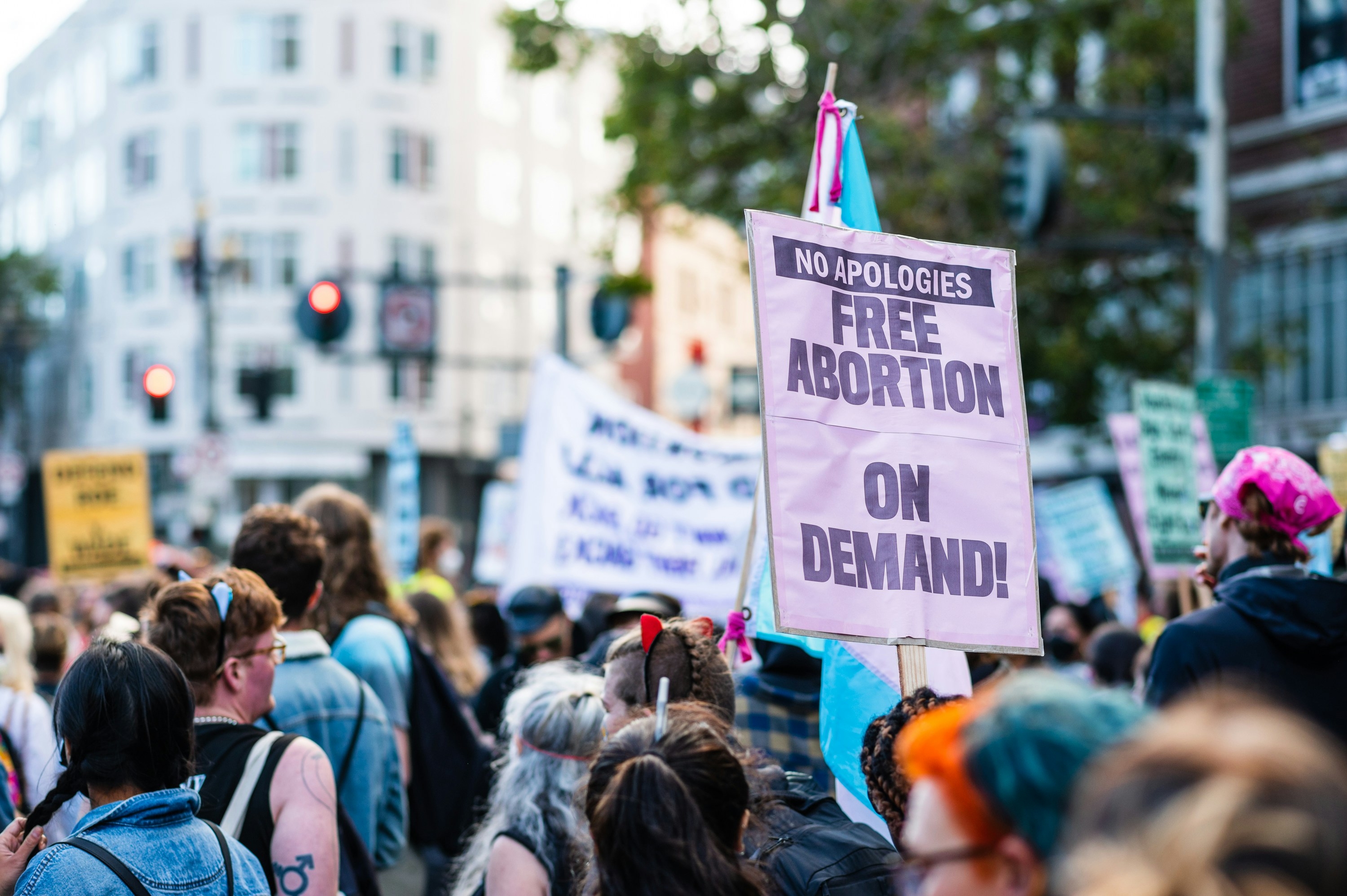 A crowd of people holding signs photo – Free Human Image on Unsplash