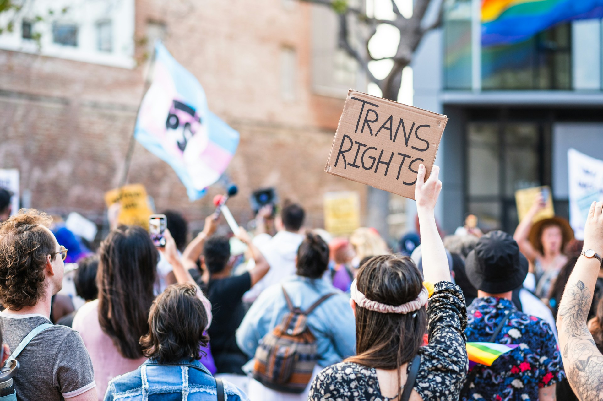 a crowd of people holding signs