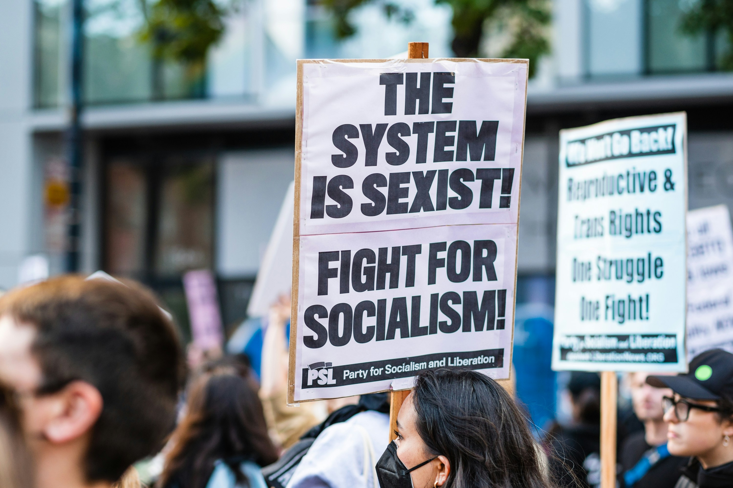 a group of people holding signs