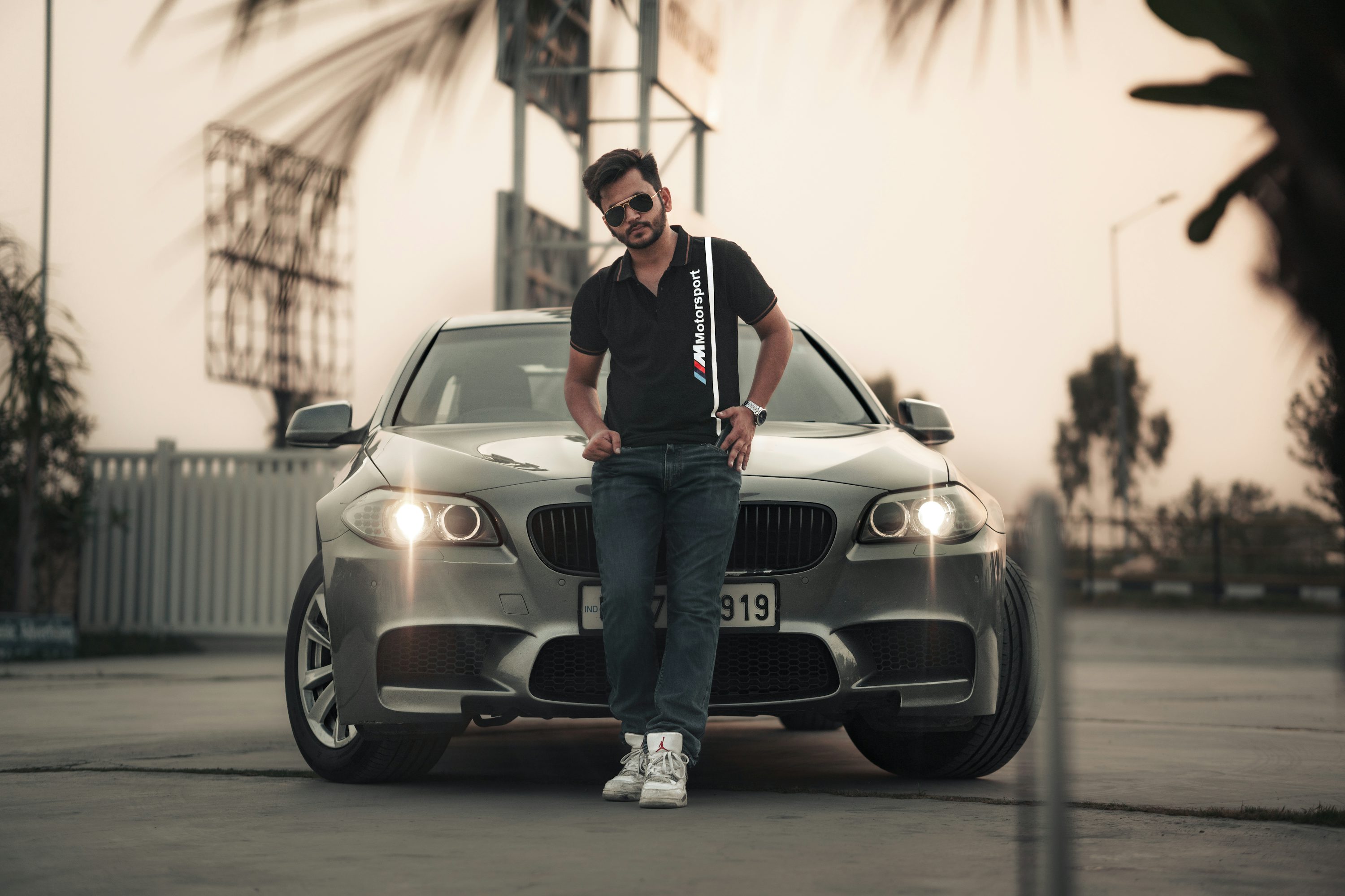 a person standing next to a car