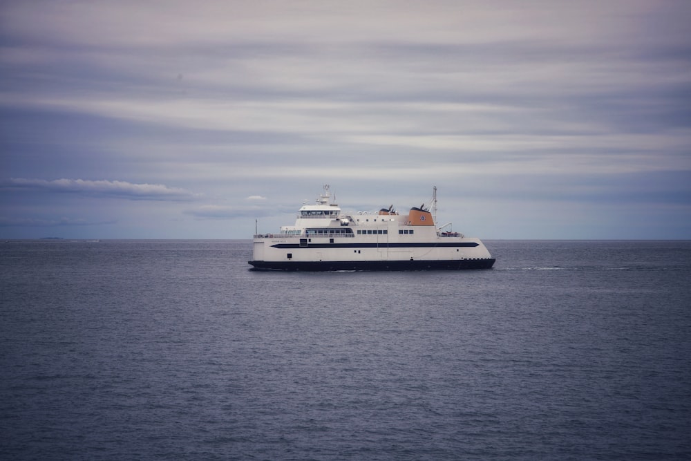 a large white ship on the water