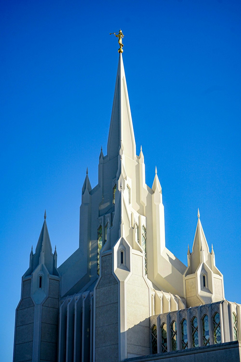 a large white building with a tall spire