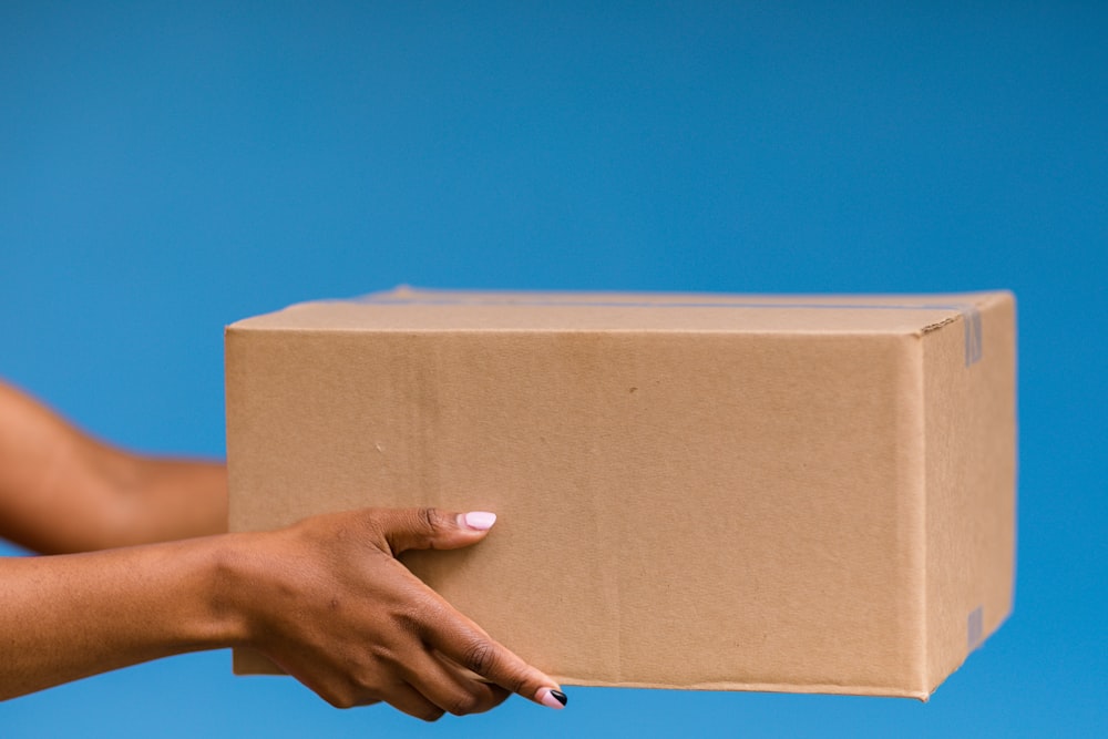 a person holding a box