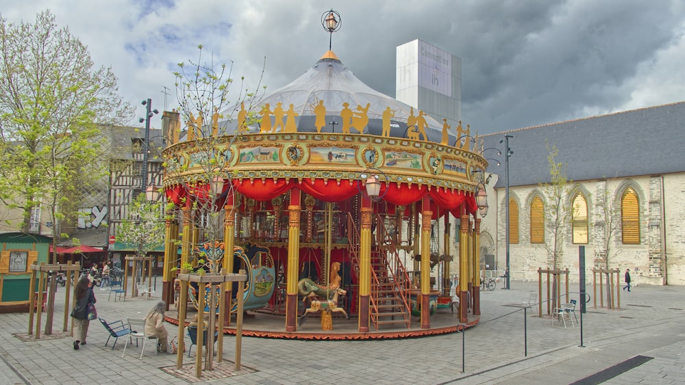 a colorful carousel in a city