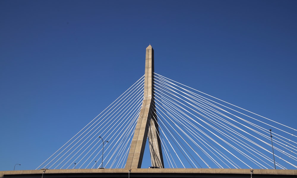 a large bridge with cables with Leonard P. Zakim Bunker Hill Memorial Bridge in the background