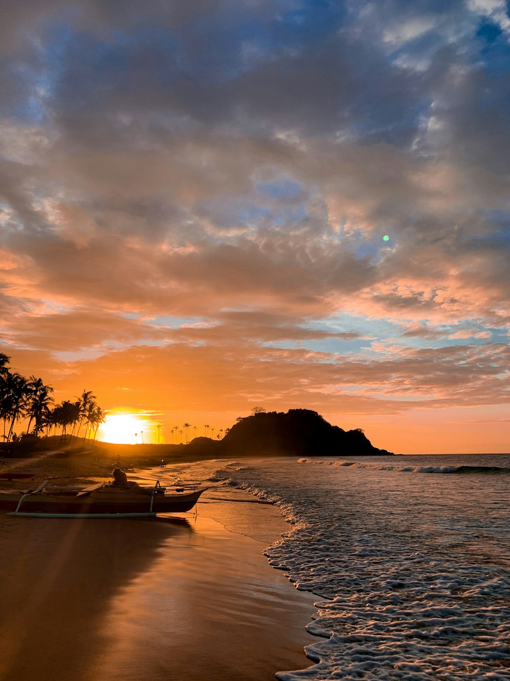 a beach with a sunset