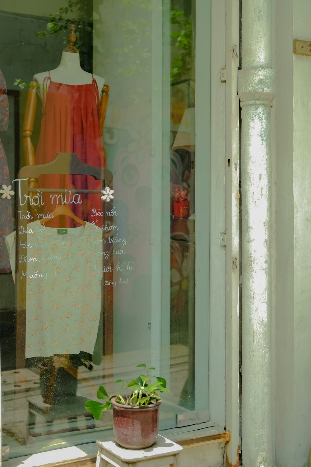 a red and yellow dress on a window