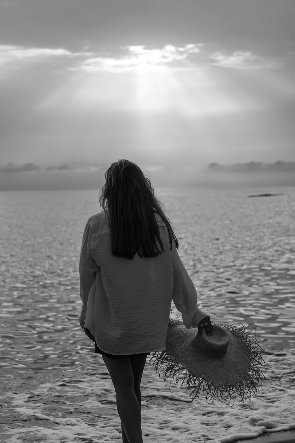 a woman walking on a beach